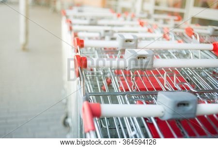 Concept: Empty Shopping Carts In The Row.