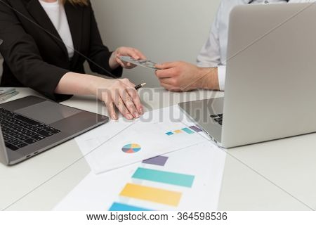 Fraud And Bribe Concept. Illegal Giving Money In Offiice.