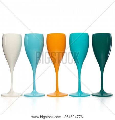 Five mulricolored champagne glasses  for gourmets. Isolated glass cup on wite background for festive events 