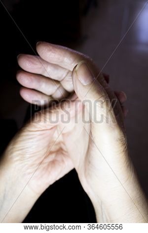 Hands Of Elderly Woman Doing A Selfmassage. Manual Physiotherapy