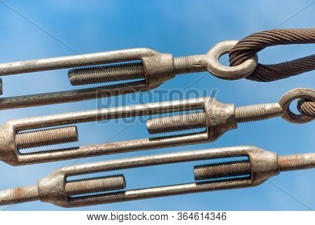 Close Up Steel Turnbuckle And Sling Steel In Construction Site On A Blue Sky Background