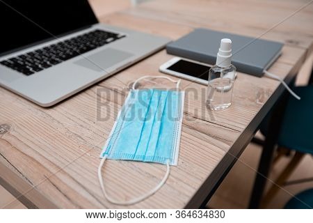Protective Mask And Bactericidal Spray On The Office Desk