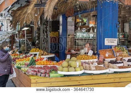 Thessaloniki, Greece - May 4 2020: Greengrocer Shop With Owner & Customer Wearing Protective Masks. 