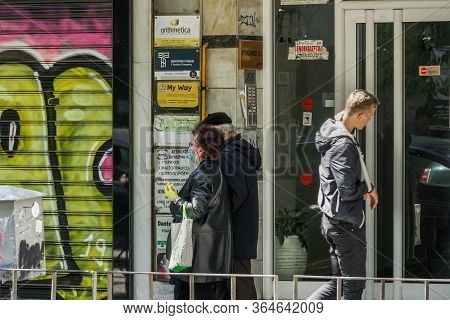 Thessaloniki, Greece - May 4 2020: Coronavirus Measures Affect Business & Daily Life. Greeks With Ma