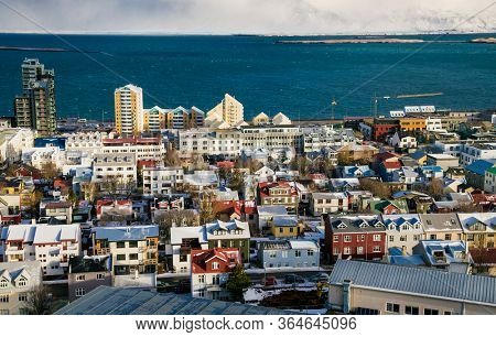 Reykjavic , Iceland- Feb 20, 2020:  Panoramic view of Reykjavik city and Atlantic ocean coast from the top of Hallgrimskirkja church. Reykjavik is the capital and largest city of Iceland.