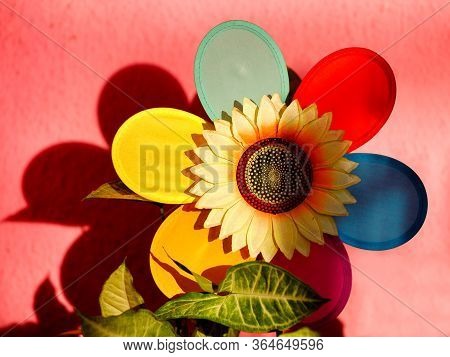 Textile Decorative Sunflower With Multiple Color Petals On Pink Background