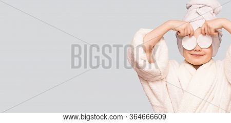 Banner View Of Beautiful Kid Girl With Towel On Head Hold Cotton Pad Disk Cleansing Face Skin With C