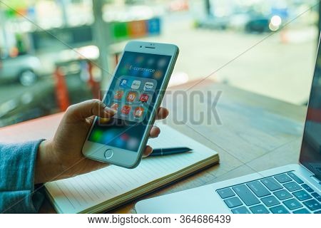 Chiang Mai, Thailand - Feb.23,2020: Woman Holding Apple Iphone 8 Plus Icons Of E-commerce And Online