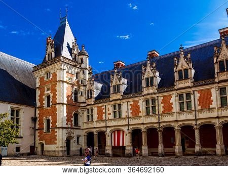 Blois, France -  26 May 2017: The Chateau Royal De Blois: The Inner Facade Of The Louis Xii Wing. Th