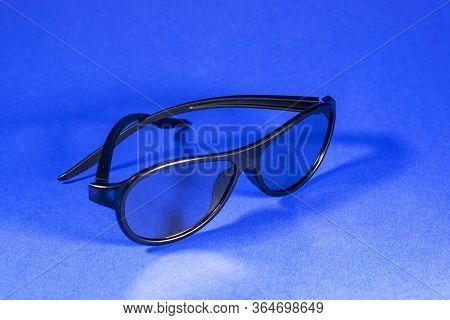 3D Glasses For Watching Movies On A Blue Background