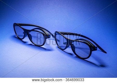 3D Glasses For Watching Movies On A Blue Background