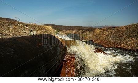 Discharge Of Waste Water Into The River. Violation Of Environmental Ecology.