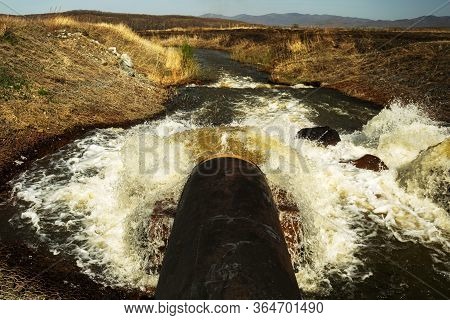 Discharge Of Waste Water Into The River. Violation Of Environmental Ecology.