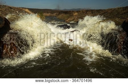 Discharge Of Waste Water Into The River. Violation Of Environmental Ecology.