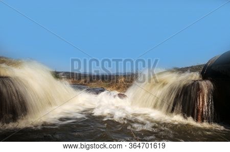 Discharge Of Waste Water Into The River. Violation Of Environmental Ecology.