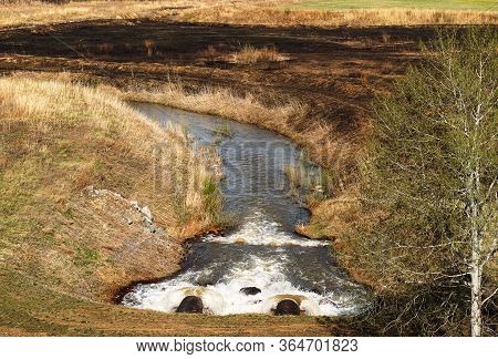 Discharge Of Waste Water Into The River. Violation Of Environmental Ecology.