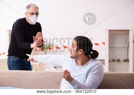 Father and son in coronavirus disease concept at home