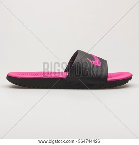 Vienna, Austria - May 27, 2018: Nike Kawa Slide Black And Pink Sandal On White Background.