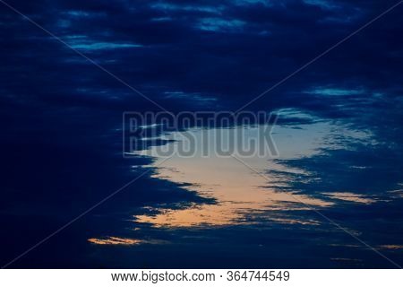 Gap In Dark Blue Clouds With Orange Sunset Sky In Entre Rios, Argentina