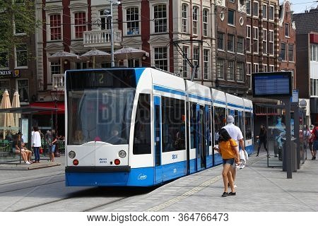 Amsterdam, Netherlands - July 8, 2017: People Ride The Gvb Electric Tram (combino Model Made By Siem