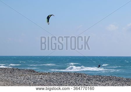 Practice In The Sea. Training For Race. Kiteboarder In Cyprus Proficiently Controls The Parachute An