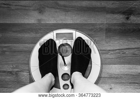 Person Standing On A Weight Scale At Home. Feets On Weight Scale With Copy Space.