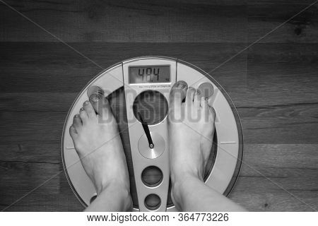 Person Standing On A Weight Scale At Home. Feets On Weight Scale With Copy Space.