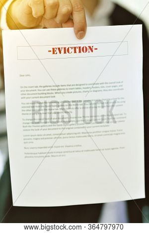 Someone Serving An Eviction Notice With Hands In View - Late Rent - Late Mortgage - Payment - Concep