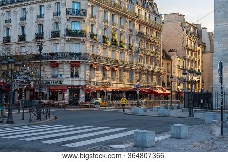 Paris, France -- November 5, 2017 -- A Man Is Out For A Walk On Rue D'arcole Near Notre Dame On A Be
