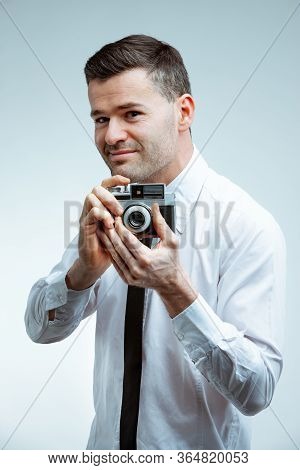 Smiling Young Man With Vintage Photo Camera