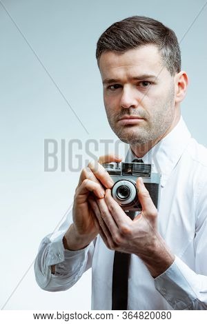 Portrait Of A Man With Vintage Camera