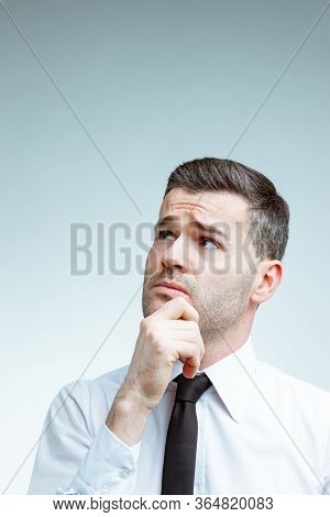 Handsome Man Looking Up And Guessing