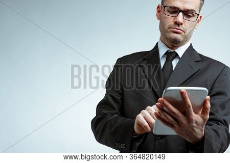 Serious Businessman Using Tablet, Copy Space