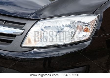 Novosibirsk/ Russia - May 02 2020: Lada Granta, Close Up  Of Modern  Car Xenon Lamp Headlight. Exter