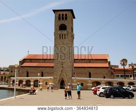 Mandraki Harbour, Rhodes, Greece - May 05, 2020: Evangelismos Church In Rhodes, Greece