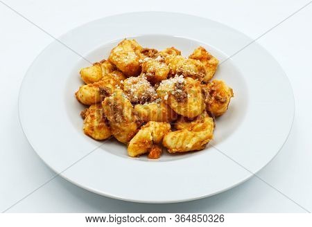 Gnocchi With Ragu Bolognese And Parmesan Cheese. Fresh Pasta Tradition Of Italy.