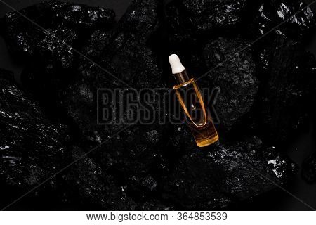 Acid Laying Among Natural Materials. Black Coal Cosmetics Top Horizontal View Scin Care And Anti-age