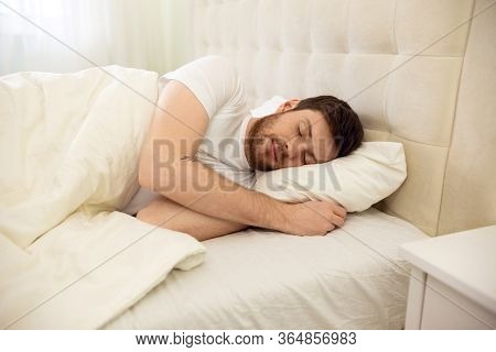 Handsome Man Sleeping Cozily In Bed At Home. Sweet Dreaming. Up Down View