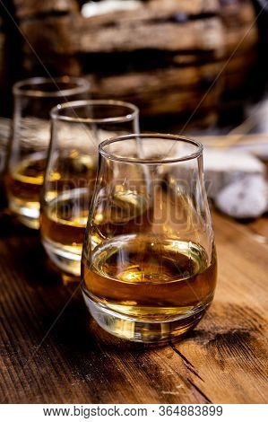 Speyside Scotch Whisky Tasting On Old Dark Wooden Vintage Table With Barley Grains Close Up