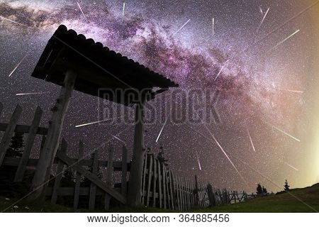 A View Of A Meteor Shower And The Purple Milky Way With Wooden Entrance Door With A Roof And Fence S