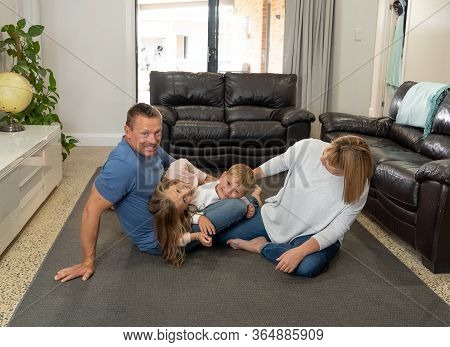 Covid-19 Stay At Home, Save Lives. Family In Staying Home Happy To Stop The Coronavirus Spreading.