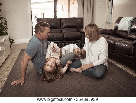 Covid-19 Stay At Home, Save Lives. Family In Staying Home Happy To Stop The Coronavirus Spreading.