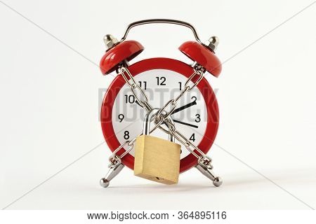 Alarm Clock With Chain And Padlock On White Background - Concept Of Time