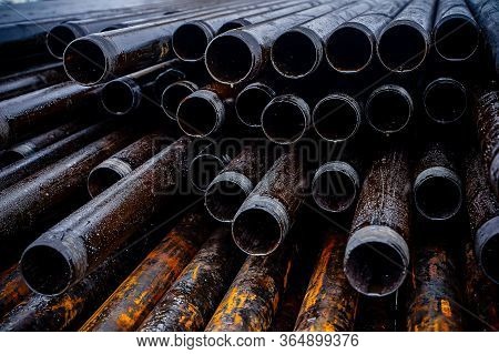 Oil Drill Pipe. Rusty Drill Pipes Were Drilled In The Well Section. Downhole Drilling Rig. Laying Th