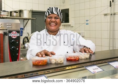 Johannesburg, South Africa - February 24, 2016: African Female Staff At Counter Of  Butchery And Del