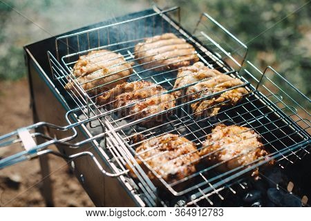 Grilled Homemade Chicken Drumsticks - Top View Close-up On The Grill Outdoors