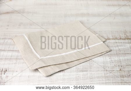 Beige Dough Cotton Napkin On A Wooden Table