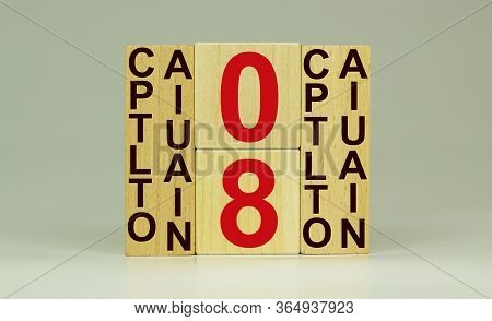 May 8 On The Calendar. Victory Day. Calendar On A White Background. Word Capitulation On Wooden Cube