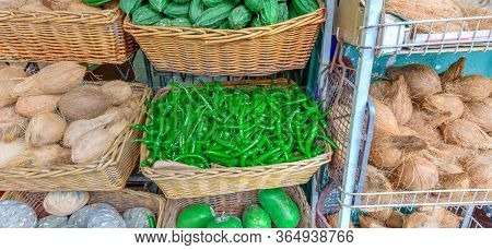 Panoramic Colorful Vegetable Stall In Little India, Singapore With Luffa Acutangula, Coconut, Acorn 