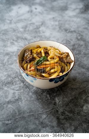 Asian Style Japanese Udon Noodle Soup With Beef, Mushroom And Vegetables.